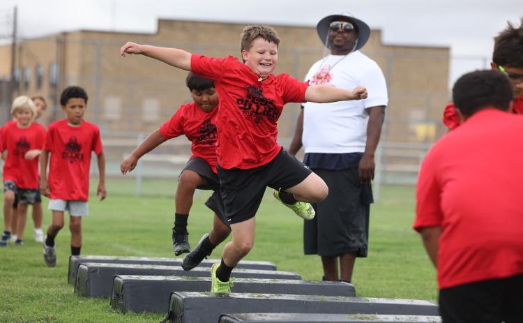 MORETHAN 50 KIDS participated in LJ Collier’s free football camp June 6, at no cost. MORE PHOTOS, PAGE 4 | SHERI BATY PHOTOS