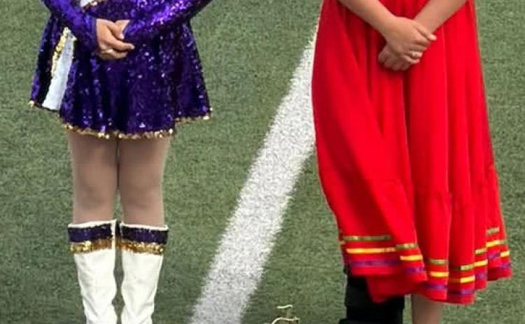 PROUD MOMENT Drum majors for the Munday Purple Cloud Band stand straight and proud with their 2nd place trophy Saturday, Oct. 3, at Abilene Wylie High School. | COURTESY PHOTO