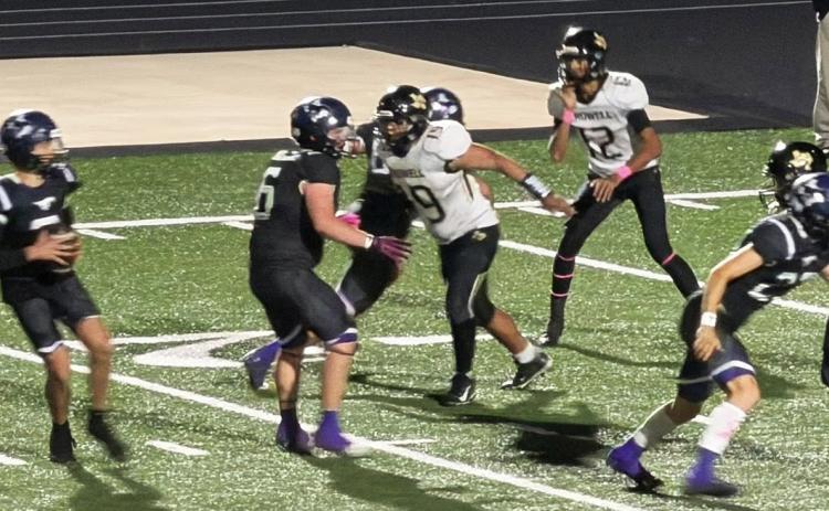 PROTECTING THE QUARTERBACK The Mustangs fight off the Wildcat defense in order to protect their quarterback. | COURTESY PHOTO