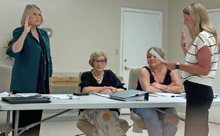 NEW MUNDAY MAYOR Karen Longan, former mayor pro tem, was sworn in April 15 by municipal judge Laura Hampel. Council member Ryan Redder will be sworn in as mayor pro tem at a future meeting. | TROY PARTON