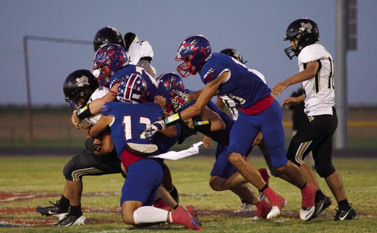 DEFENSIVE STOP The Greyhound defense makes the stop behind the line of scrimmage | SHERI BATY PHOTO