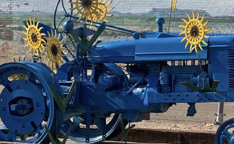 METAL MARVELS Knox City, Texas, has long enjoyed the benefits of delighting travelers and residents with its series of colorfully painted sculptures made from tractor and implement parts reimagined as insects, growing things, and more. They are installed throughout town, often in proximity to murals on weathered walls. | COURTESY PHOTOS
