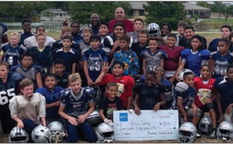 ANSON—MTC Bluebonnet Detention Center recently donated $750 to the Abilene Cowboys Youth Football team. Warden Steve Mora encouraged the team to continue to work hard both on and off the field. Organization President Jay Williams said the funds will be used to allow all eligible youth to participate, regardless of their ability to pay. Management &amp; Training Corporation (MTC) operates the Bluebonnet Detention Center in Anson for Immigration and Customs Enforcement(ICE). Courtesy photo