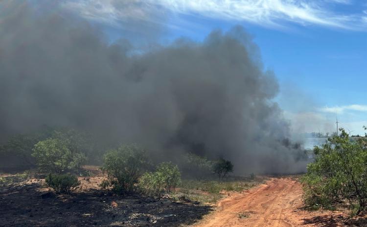 HEAVY SMOKE Thick smoke from hundreds of smoldering rubber tires filled the air and shut down a portion of highway 222 in Knox County Thursday afternoon. There were no buildings involved, and the fire was covered to the south side of the highway.