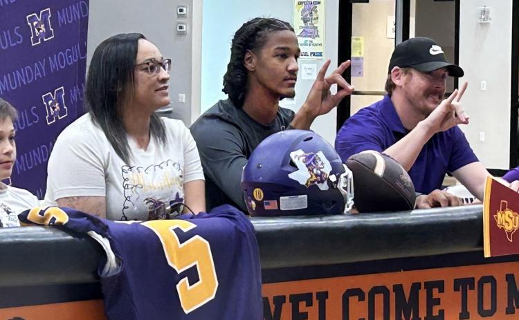 MOGULTO MUSTANG As he signed his letter of intent to play football for Midwestern State University, Ja’Riyis Williams (center) was surrounded by his mother, Shadee, stepfather, Ryan, and his two younger brothers. | COURTESY PHOTO