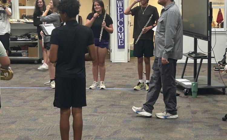 SMALL BUT MIGHTY Munday students working under new directors out of the heat for the first couple of practices refining the basics before hitting the field.