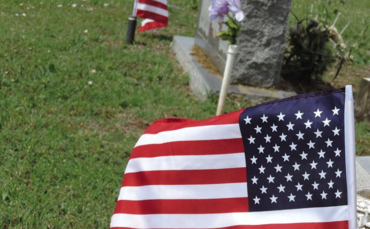 VERA—Memorial Day flags fly at the graves of veterans in the Vera Cemetery, including several who served in the Confederacy. Hanaba Munn Welch/The Knox County News-Courier