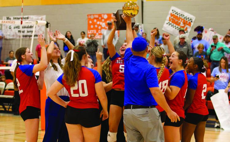 RAISING THE TROPHY The Houndettes celebrate the Bi-District win over Trent | SHERI BATY PHOTO