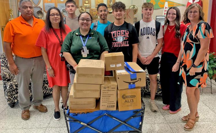 ANSON ISD RECIEVES DONATION Bluebonnet Detention Center (BDC) in Anson donated school supplies to Anson ISD on Monday, August 11, 2025. Pictured l-r BDC Warden Marcello Villegas, Ms. Ramos, back Hayden McCullough, front BDC Sgt. Marissa Rodriquez, back Zach Lomas, Brody Hall, Samuel Wilburn, Harper Dillard, and Principal Overby. | COURTESY PHOTO