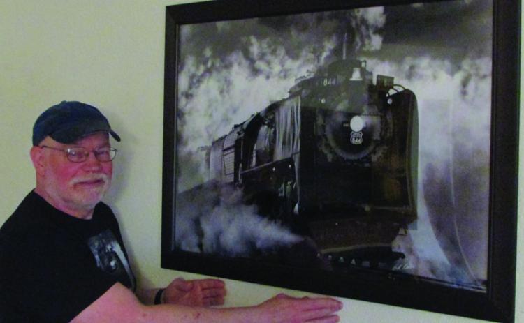 Bill Kessler with photo of engine Union Pacific #844. Don Thompson/The Knox County News-Courier