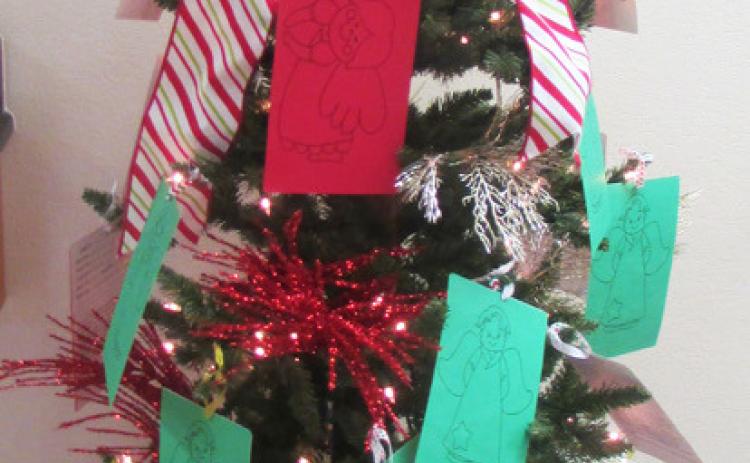BE AN ANGEL TO A CHILD Shopping for a name taken from one of the Angel Trees in Knox County will bring a huge smile to a child’s face on Christmas morning. | COURTESY PHOTO