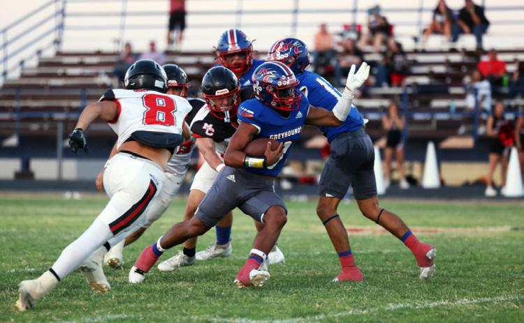 BREAKING FREE Greyhound Zander Abila eludes the tackle for a big run in Matador Sept. 19. | SHERI BATY
