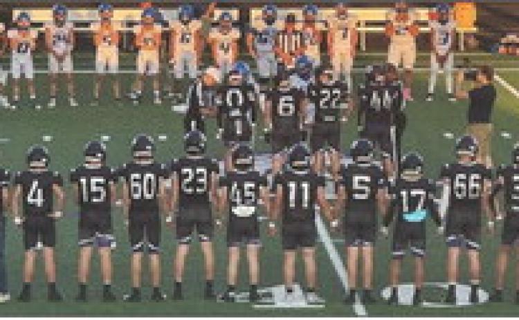 OPENING COIN TOSS The Mustangs meet midfield for the coin toss to open Friday night’s game at home against the Cherokee Indians. | COURTESY PHOTO