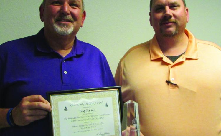 MCISD Superintendent Troy Parton is presented with the Community Builder Award for Non-Masons by Mason Trey Singleton. Don Thompson/The Knox County News-Courier