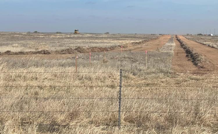 DIRT WORK FOR SOLAR ENERGY Earth movers are preparing the site of the ZSS Solar project, with the greatest area of activity to the west and northwest of the Tesla station just west of FM 276 between Rhineland and Munday, near Johnson Memorial Cemetery.