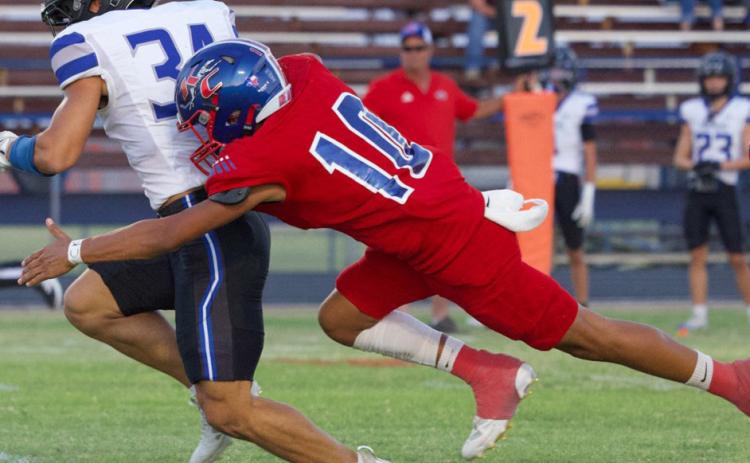 PANTHER DOWN Hunter Lerma takes down the Abilene Christian High School Panther Friday night during Knox City’s Homecoming. | SHERI BATY PHOTO