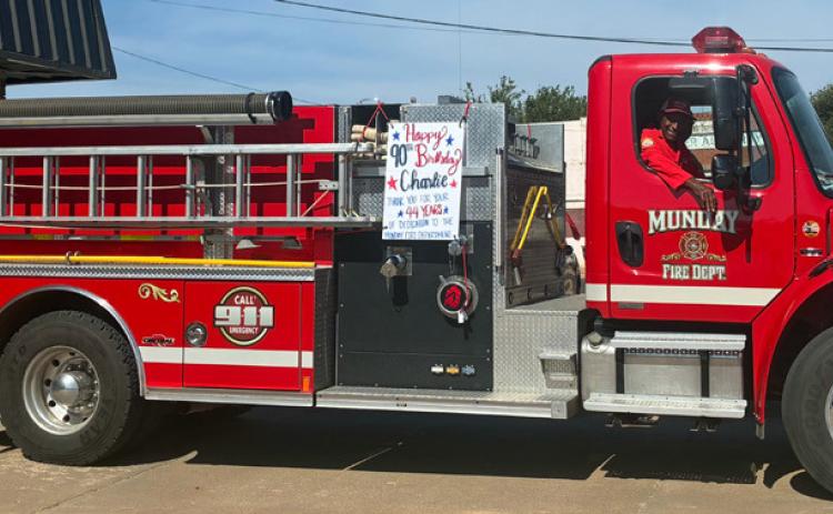 A BIRTHDAY CELEBRATION for 90-year-old Charlie Cooks began with the first vehicle of Munday’s Fourth of July parade. Cooks, a Munday VFD member since 1982, currently serves as chaplain for the department. | COURTESY PHOTO