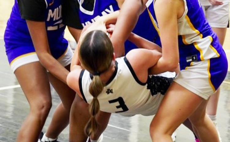 LOOSE BALL The Munday Mogulettes hustled after a loose ball in last week’s game against Archer City. The Mogulettes were defeated 51-43, however they turned it around with a win over Rule 42-22. | LACI BOWMAN PHOTO