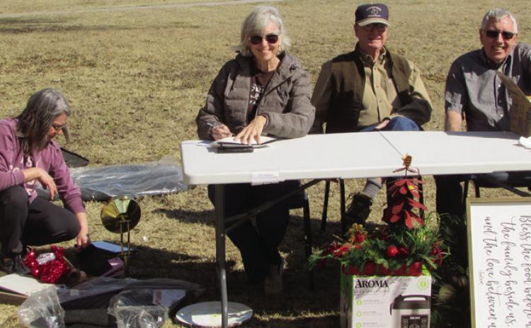 FUNDRAISER Manning the tables outside at the Methodist garage sale, from left – Leann Harlan, Debbie Welborn, Jim Cowsert, Jamie Welborn | DON THOMPSON PHOTOS
