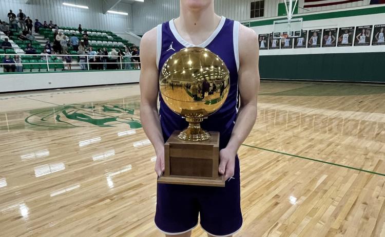 GOLDBALLSEASON Junior Matteo Schwetting shows off Benjamin bi-district gold ball afterTuesday night's win. | SUE JANE SULLIVAN PHOTO