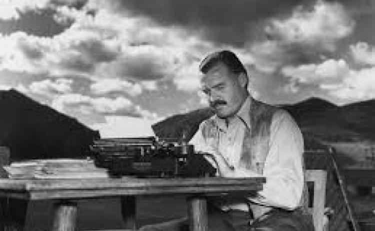 Ernest Hemingway at his typewriter.