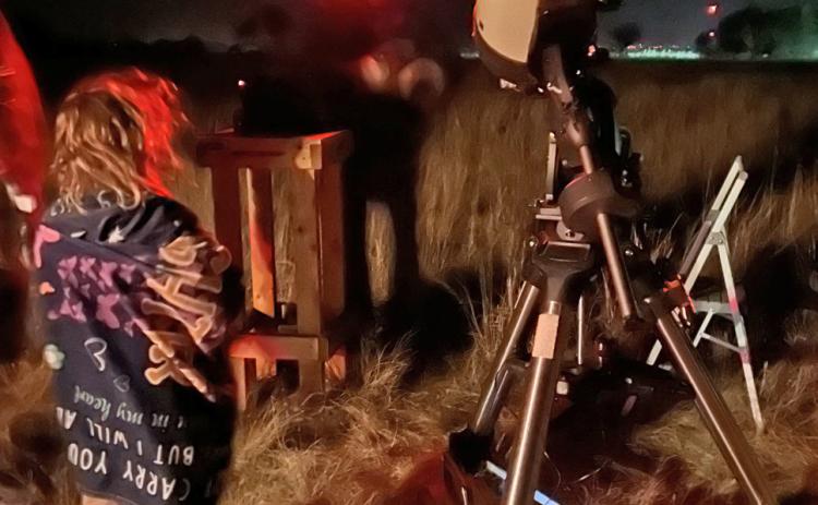 STARGAZING Gazing at the stars through the telescope with Alex Vakusin. |COURTESY PHOTO