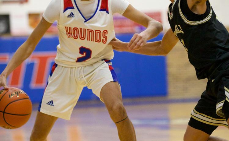 DRIVES Joe Adam Morelos takes the pressure from the Crowell Wildcar as he drives down the court. | SHERI BATY PHOTOS