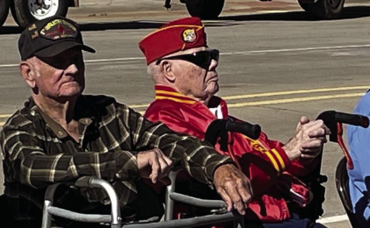 OLDESTVETERANS Front row seats reserved for older veterans, L to R, Walter Kirkpatrick, Glen Dell Large, Robert (Bob) Lake, and Frank Dutton. | DON THOMPSON PHOTO