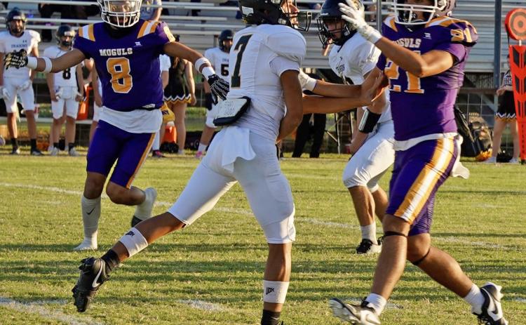 PRESSURING THE QUARTERBACK David Walker gets into the backfield and rushes the Dragon quarterback in Friday night’s game against Chico. MORE MOGUL PHOTOS, PAGE 8 | LACI BOWMAN PHOTO