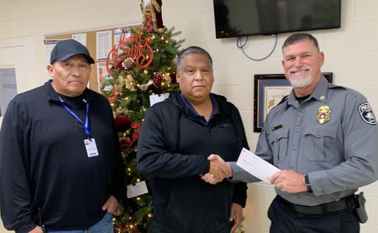 2025 BLUE SANTA DONATION Bluebonnet Detention Center recently donated $750 to the Anson Police Department’s Blue Santa Program. From left, BDC Deputy Warden Leandro Hernandez, BDC Warden Marcello Villegas and Anson Police Chief Dan Graziose participated in the presentation. | COURTESY PHOTO