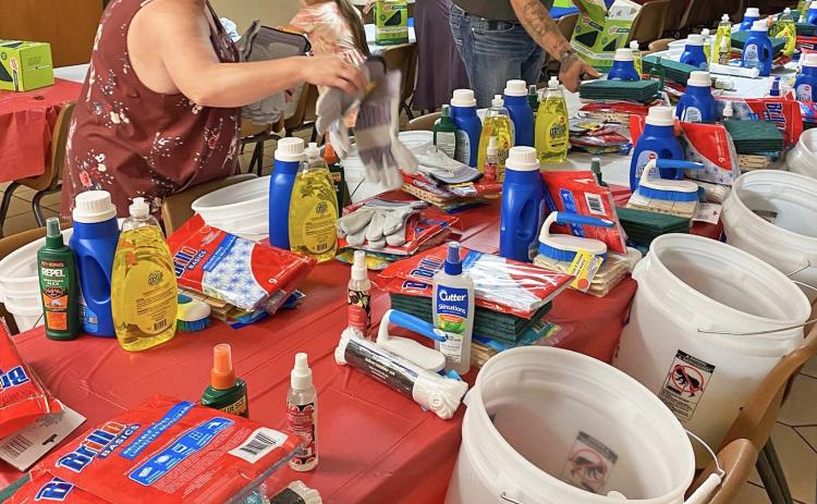 VOLUNTEERS ORGANIZED DONATIONS last week at the Knox City Methodist Church, preparing to pack“flood buckets”of cleaning necessities to help communities recover from flooding in central Texas. | COURTESY PHOTO