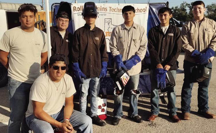 WORLDOFWORK RPTS students setting up in the Abilene Civic Center parking lot for the 2023World of Work Youth Expo in Abilene this past week. Back row: Trevor Henry, Justin Serrano, Billy Taylor, Nemo Silvas, Teagan Reyna, Logan Isbel. Front: Evan Enriquez. | COURTESY PHOTO