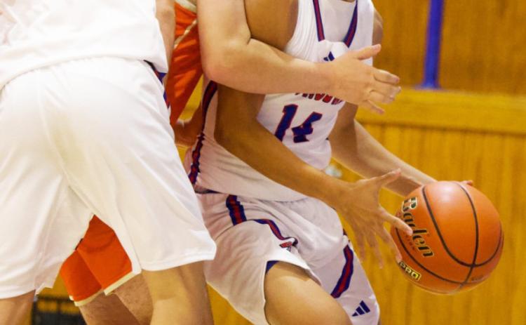 BASELINE TO THE RIM Knox City’s Jaidev Casarez drives the baseline to the rim for two points against Rotan. | SHERI BATY PHOTO