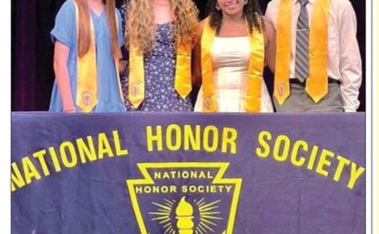MUNDAY HIGH SCHOOL INDUCTS NEW MEMBERS The Munday High National Honor Society was pleased to induct four new members last week. The ceremony was held in the high school auditorium. The newest members are David Lewis, Rachel Hernandez, Loran Miranda, and Olivia Myers. These four students excel in character, leadership, academics, and service to their community. A reception was hosted by the current NHS members after the ceremony to honor the new members. | COURTESY PHOTO