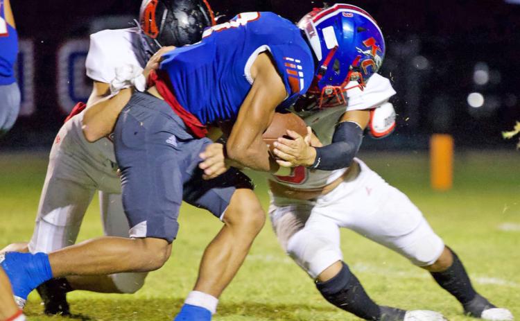 THE PUSH IS ON AGAINST STRAWN Zander Abila tries to push closer to the goal line. | SHERI BATY PHOTO