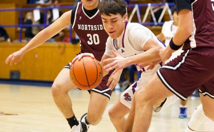 WORKINGTHELANE Knox City’s IzaiahTrevino takes the pressure and keeps working the lane in last week’s game versus Northside when the Hounds came away with the win 45-31. See story and more photos page 8. | SHERI BATY PHOTO