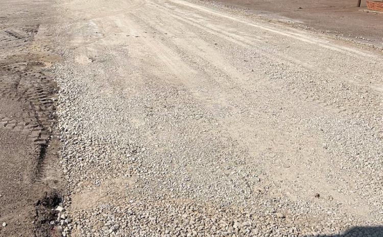 ASPHALTREADY Funded by theTexas Department of Agriculture, this road will soon be covered in asphalt; the packed down road base is ready and waiting. | TROY PARTON