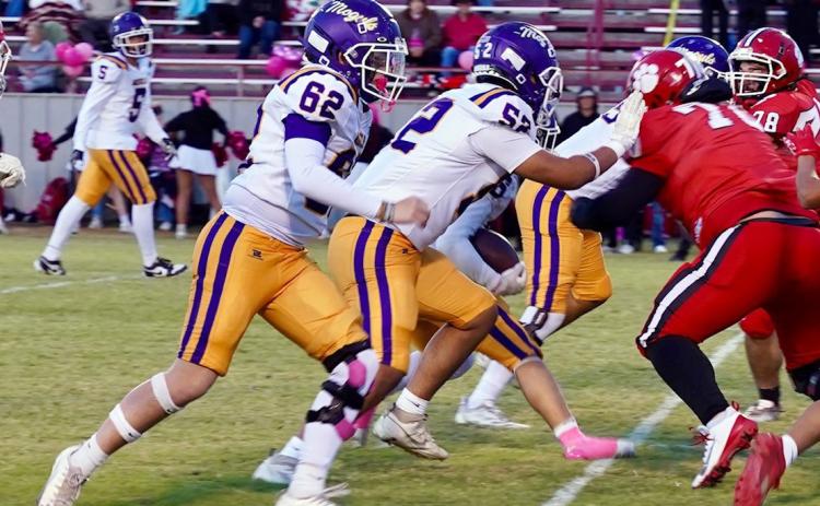 Offensive linemanTatum Hoffman and Amyas Ibarra make some room for the Mogul running back. Story and highlight photos, PAGE 5 | LACI BOWMAN