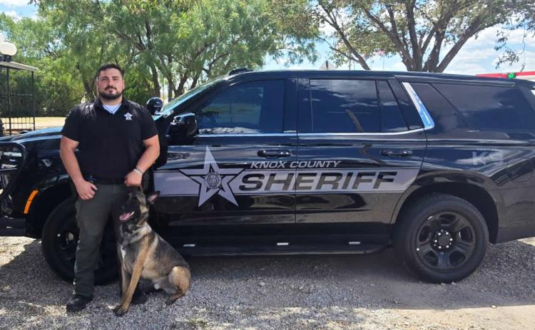 NEWRIDE Deputy Garza and K9 Deputy Max pose in front of their new wheels.The specially equipped Tahoe features a kennel, cooling fans and a heat sensitive locking system, to keep Max cool and ready for duty. | COURTESY PHOTO
