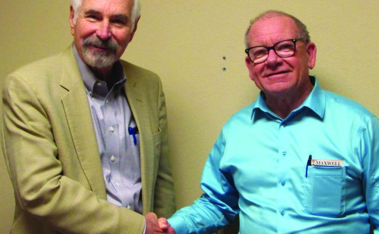 Judge Stan Wojcik swears in Dr. Michael Bennington. Don Thompson/The Knox County News-Courier