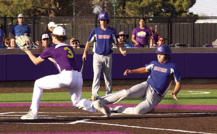 SHOWDOWN Chase Rowland slides for homeplate. see more photos page 6. | SHERI BATY PHOTO