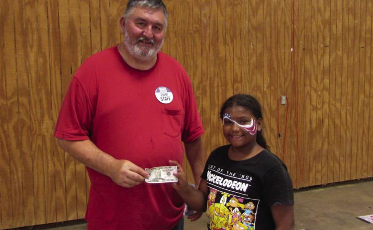 THEWINNEROFTHE 12&amp;underHotDogEatingContesttookhome the $100 prize. | DONTHOMPSON PHOTO