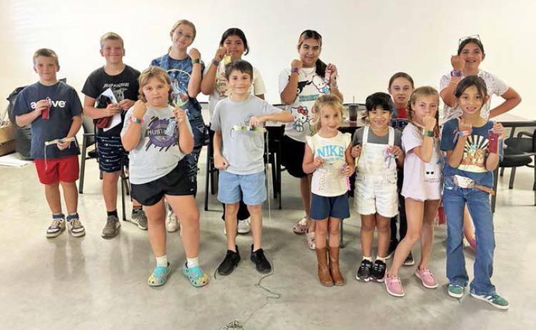 4-H SEWING CAMP The Knox County 4H Sewing Campers (below) tapped into their creative skills and created a woven bracelet and a sewn chapstick holder COURTESY PHOTO