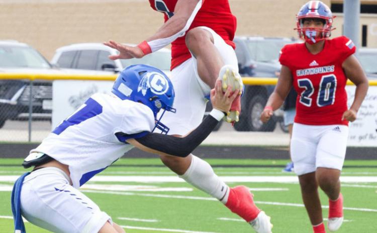 KC GREYHOUNDS SEASON OPENER The Greyhounds opened their 2025 football season at the Jayton Gridiron Classic against Cherokee on Saturday, Aug. 30, falling 30-62 to the Indians, despite Zander Abila leaping to new heights to gain some yards. | SHERI BATY PHOTO