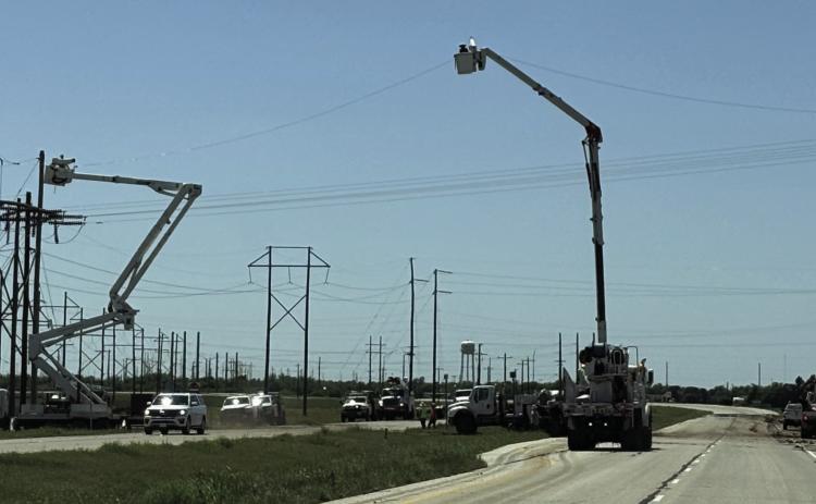 STORM CLEANUP PROGRESS Work continued Saturday afternoon May 3, 2025, to repair the electric infrastructure on Hwy 222 east of Munday after the previous week’s severe storms and straight line winds. | DON THOMPSON PHOTO