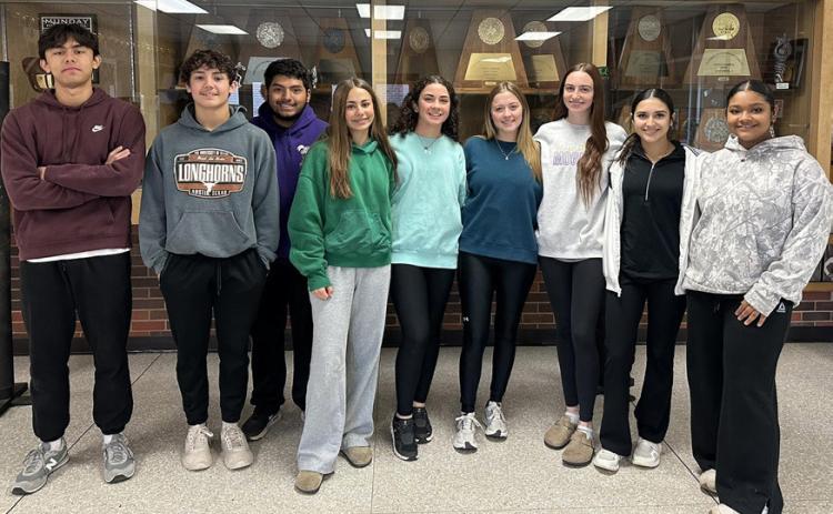Munday High School teachers Karen Longan and Katie Wilde, along with Munday National Honor Society and student council members, decorated downtown Munday and helped clean up The Rock Church to prepare the city for the holidays. | COURTESY PHOTO