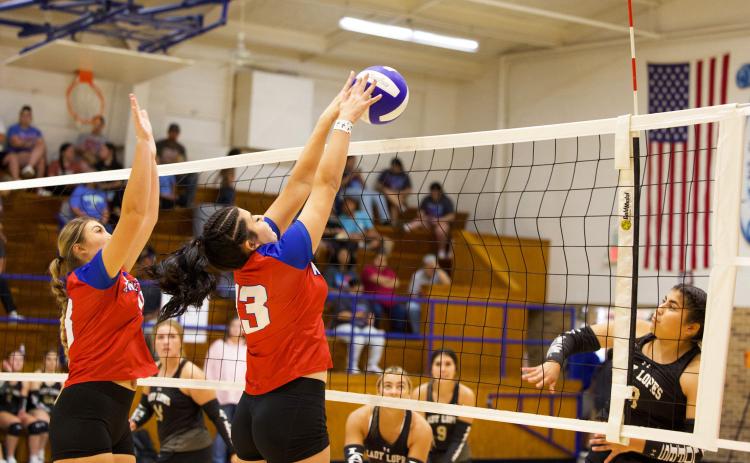GOING FOR THE BLOCK Houndette Lexi Abila makes the block in last week’s game against Post. | SHERI BATY PHOTO