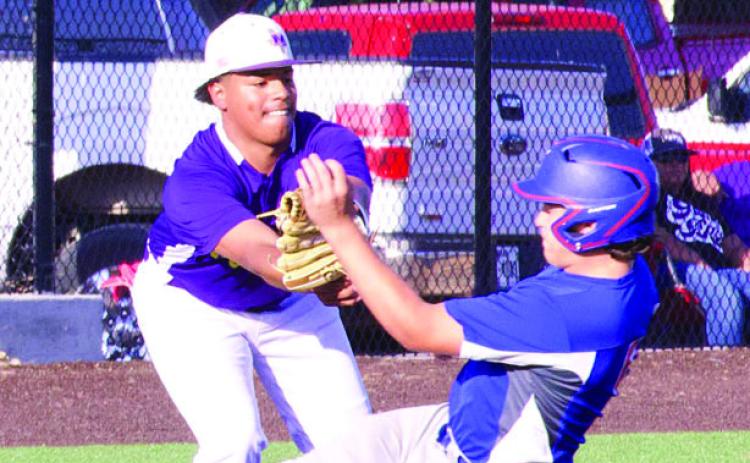 The Munday Mogul third baseman is keeping the corner hot with the tag. | SHERI BATY PHOTOS