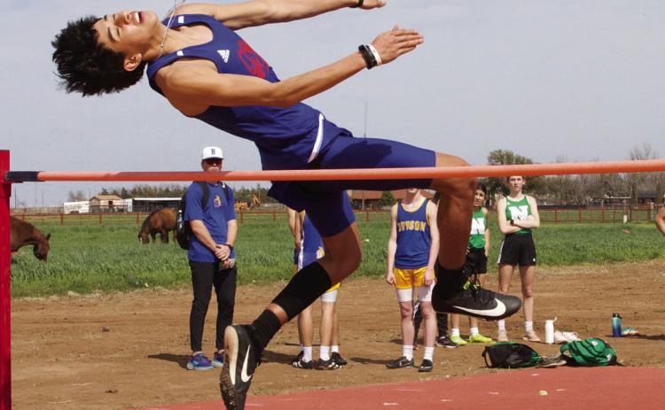 Joe Adam Morelos clears the bar at the high jump. | SHERI BATY PHOTO
