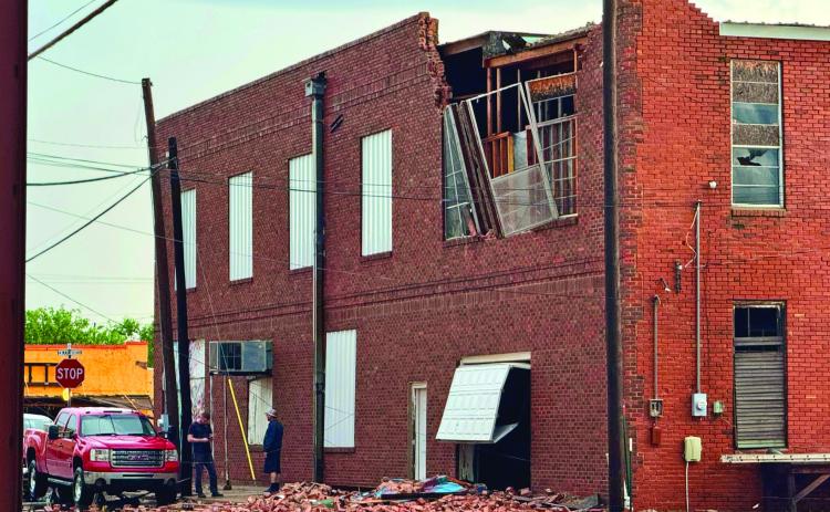 BRICK DESTROYED The Main Street Performance Auto shop in Munday, owned by J. R. Hodges, lost bricks and a window from its upper story when high winds blew through around 6:30 p.m. April 29. | RACHEL FARMER PHOTO